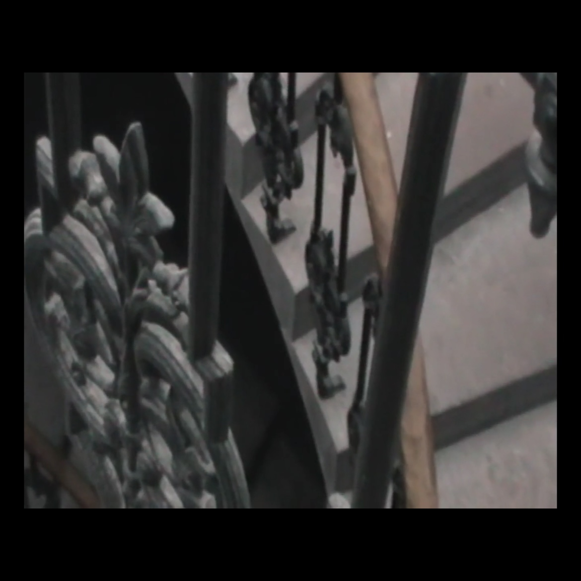 Video still from MP4 video file showing railings and stairs.