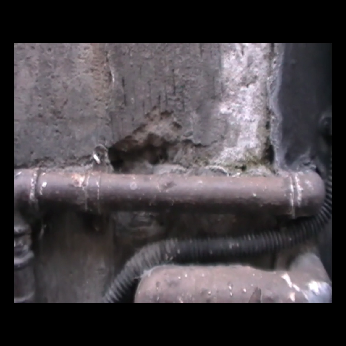 Video still from MP4 video file showing pipe close up.