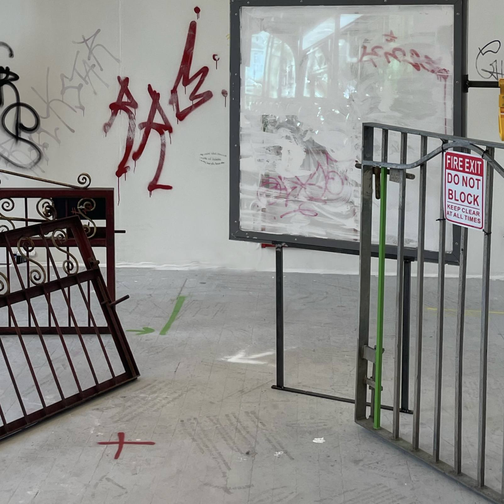 Fences and traffic signs installation with graffiti and video projection.