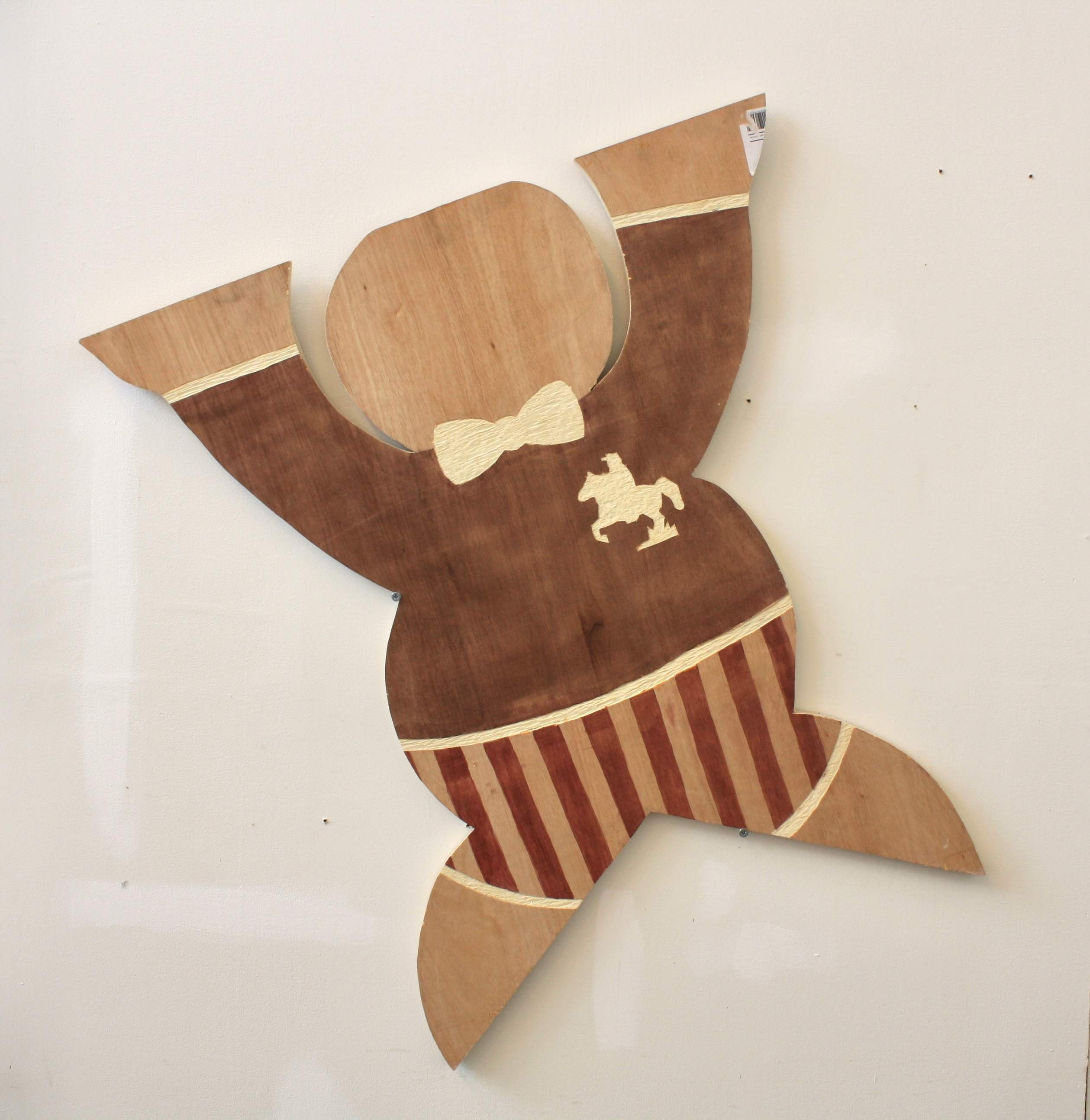 wooden figure on wall 