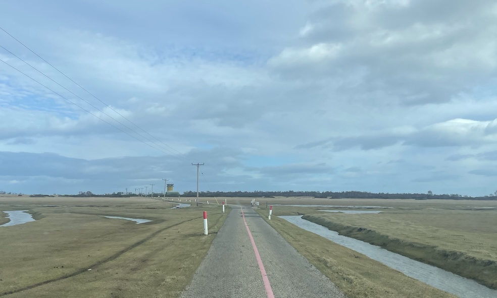 Tarmac road through saltmarsh, leading to Tain Air Weapons Range Head-Quarters