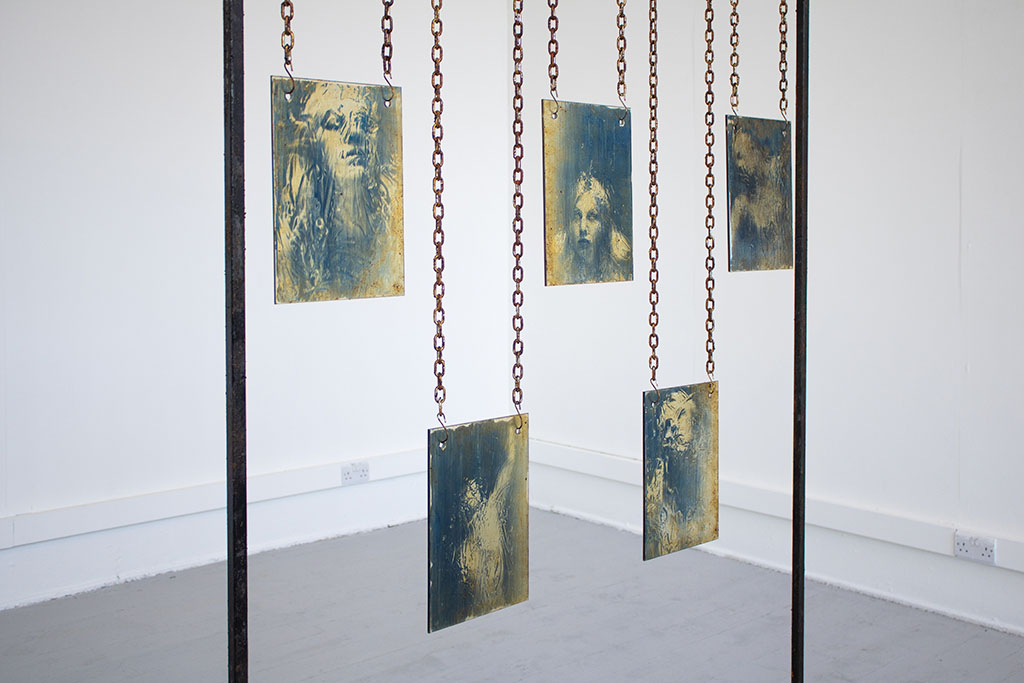 Cyanotypes on glass, suspended from metal structure
