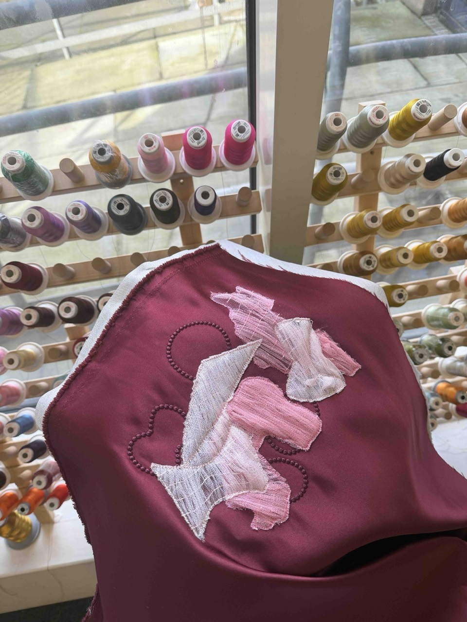 Cad Embroidery applique process- burgundy duchess satin & mesh smocking