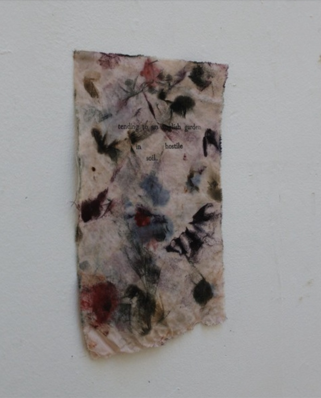 Pictured: a relatively small oil painting rag with the following printed 'tending to an English garden in hostile soil' in amongst the oil paint smudge marks