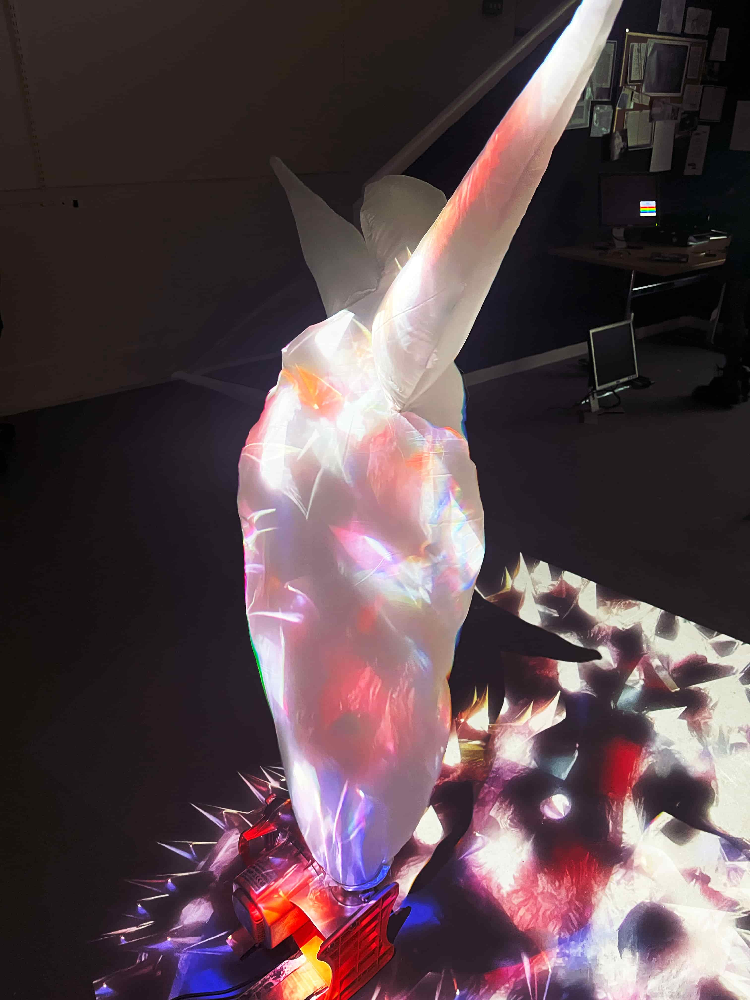 inflatable man with colour projection over him