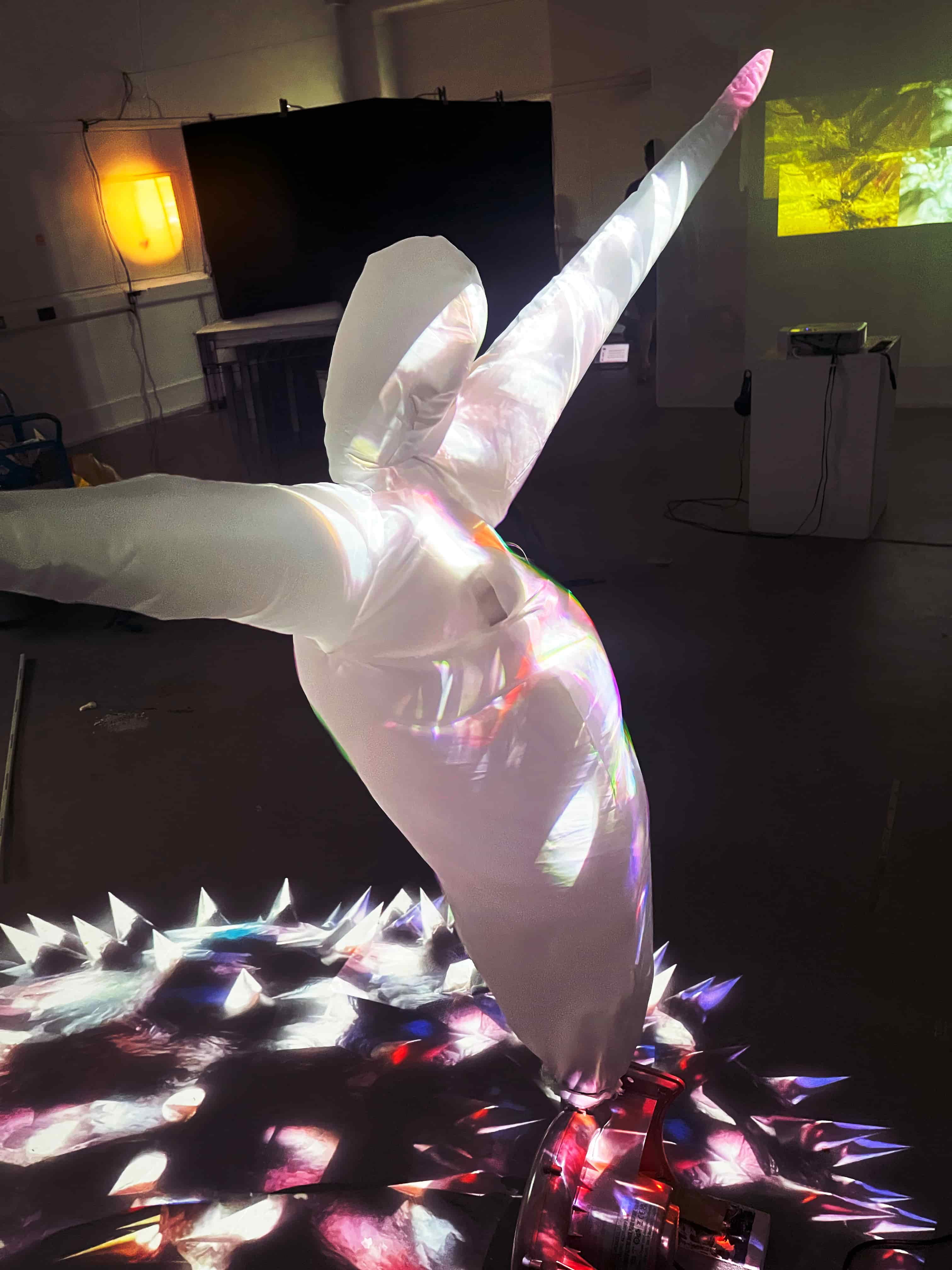 inflatable man with colour projection over him