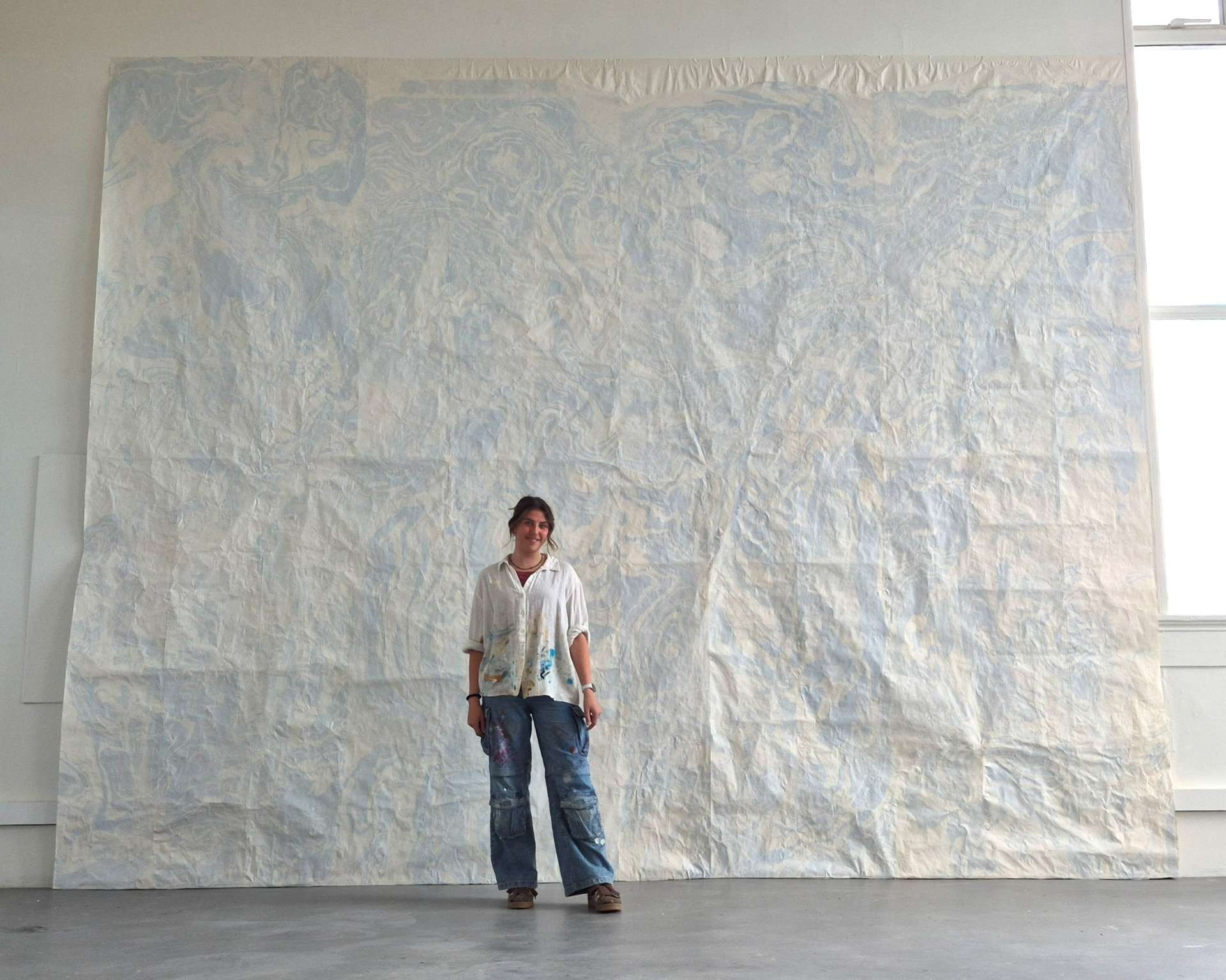 Azli (artist) stood in front of Graduate Show Piece