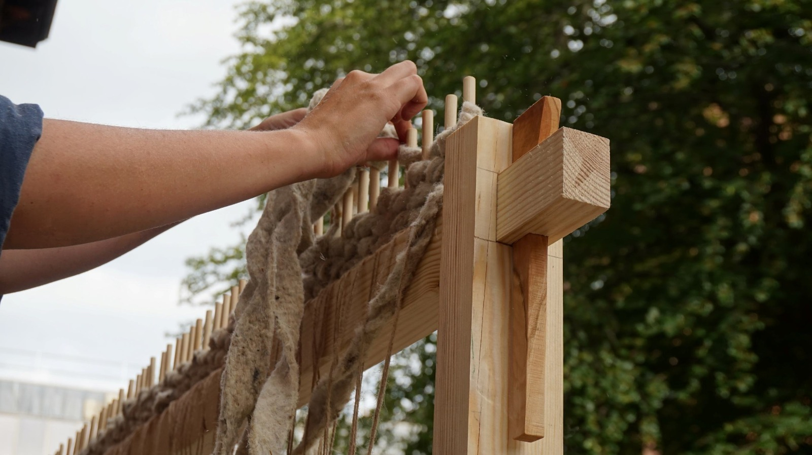 Close up on hands weaving